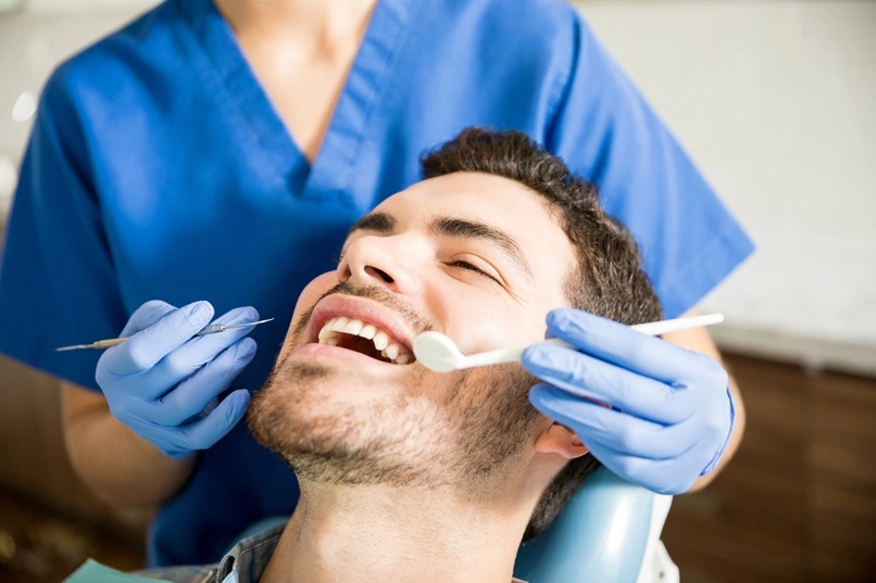 MAP Dental same-day emergency treatment West Houston — patient chairside MAP Dental Center Houston.